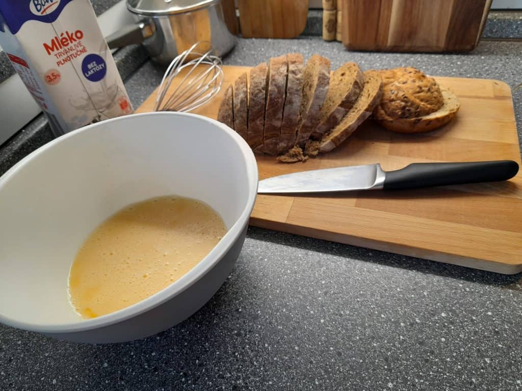 preparing the whisked egg mixture for bread in egg